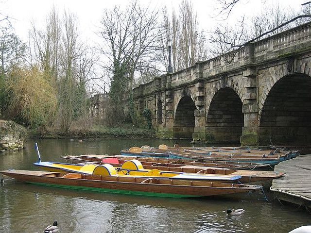 Punting On The River Cherwell Approaching Magdalen Bridge In Oxford Britain Image242621403